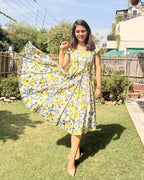 Flowy panelled cotton dress with citrus floral print wide flare detail
