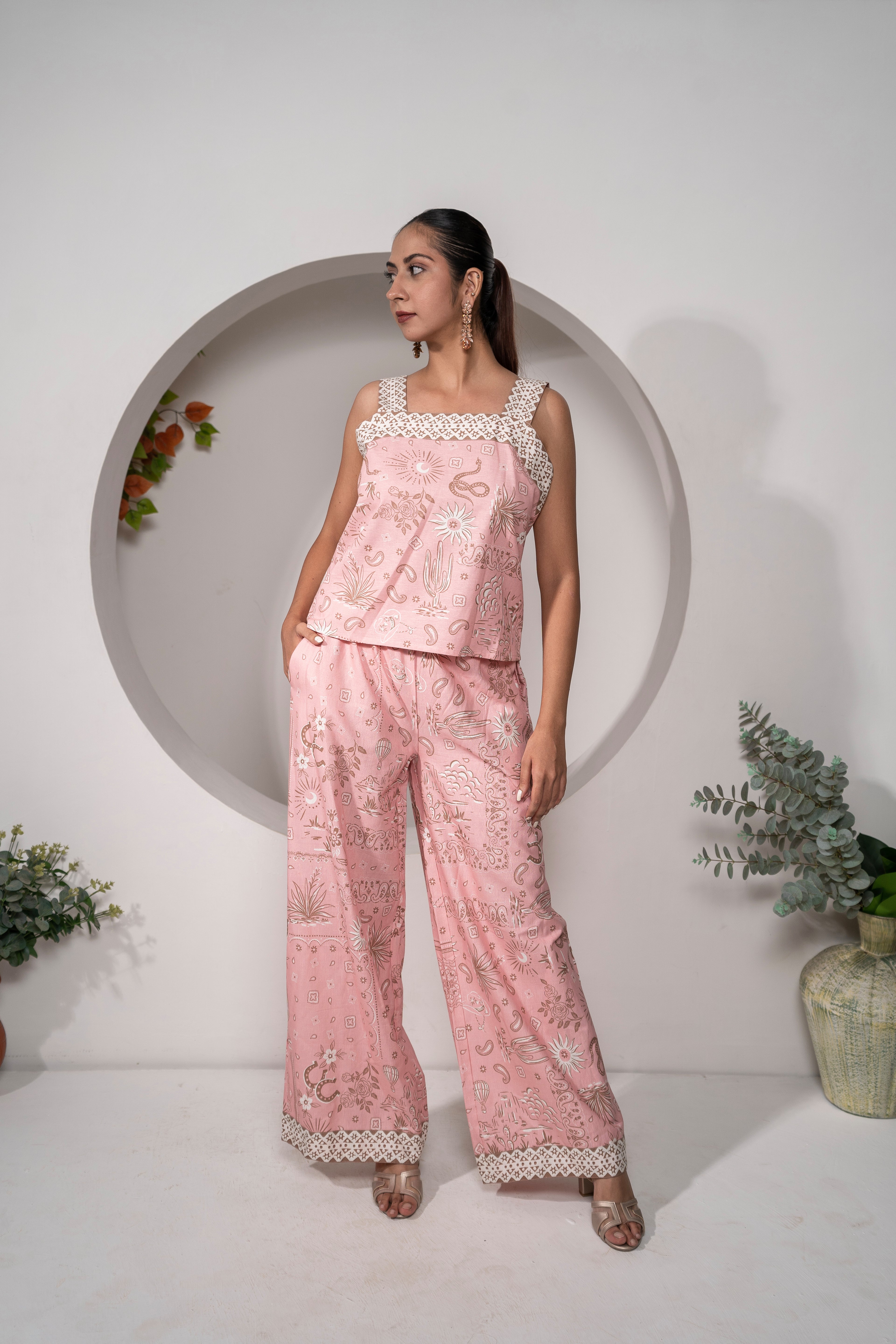 Woman wearing a Desert Rose Pink Printed Cotton Co-ord Set – Vacation & Resort Wear outfit with a white background