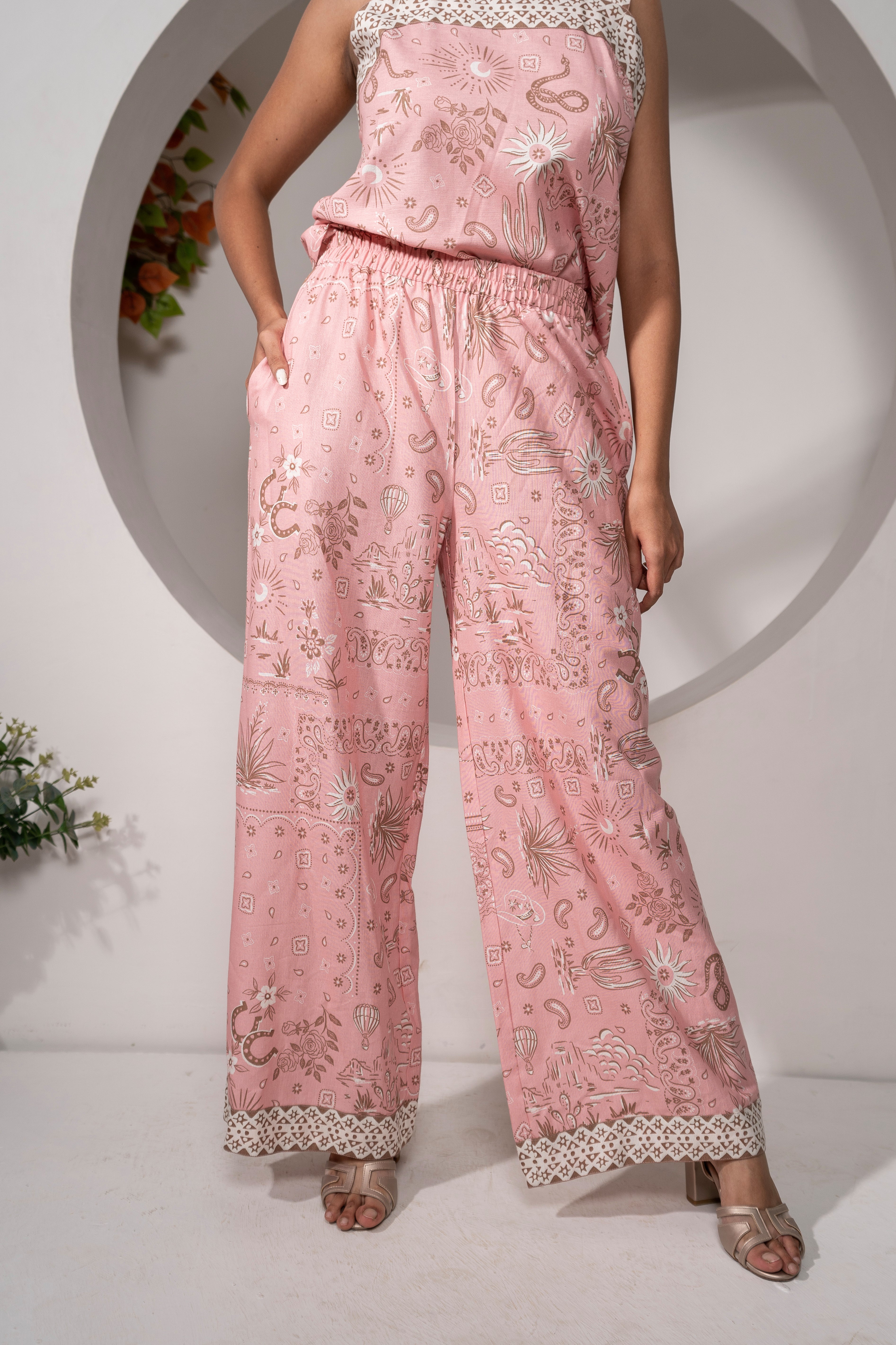 Khamna's Desert Rose Pink Printed Relaxed Pants – 100% Cotton wide-leg pants Front View. Fully Elasticated  waist. Contrast print on hel
