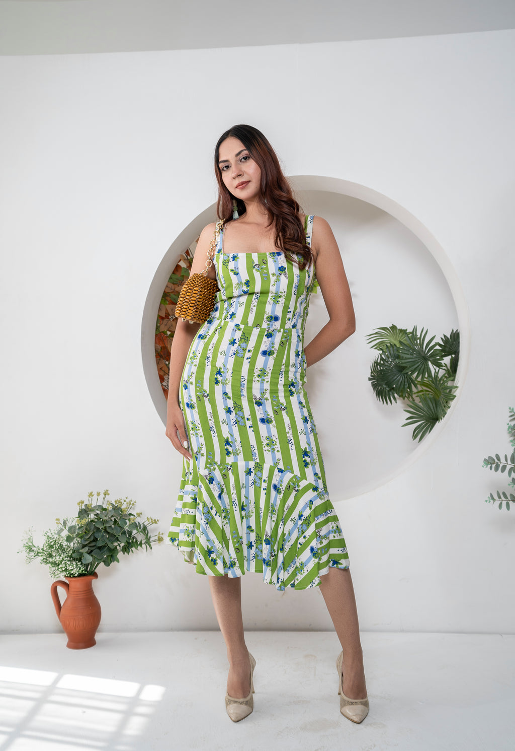 Khamna Verdant Bloom – Striped Flared Midi Dress front. Dress in blue white and green print with Blue flowers all over