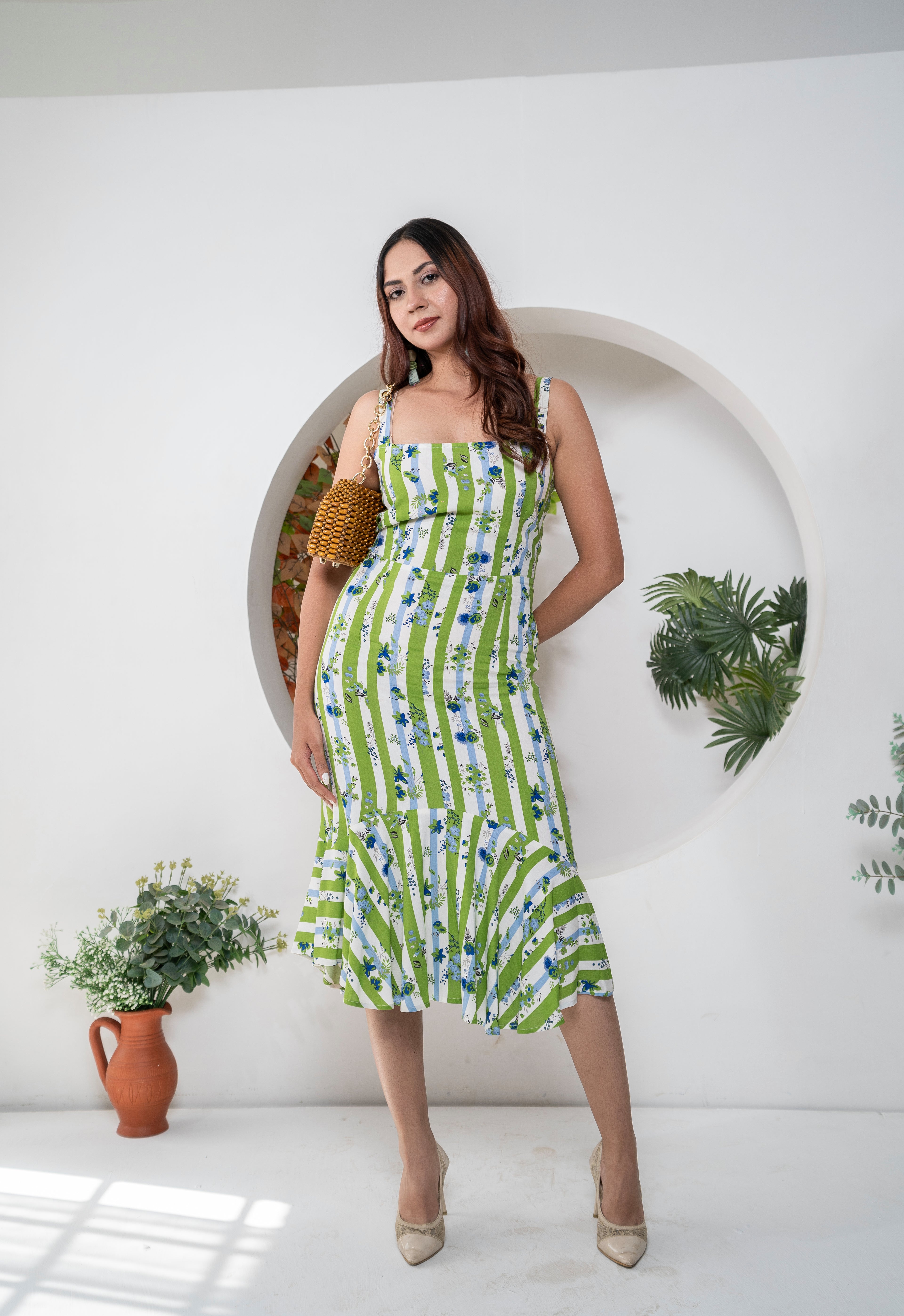 Khamna Verdant Bloom – Striped Flared Midi Dress front. Dress in blue white and green print with Blue flowers all over