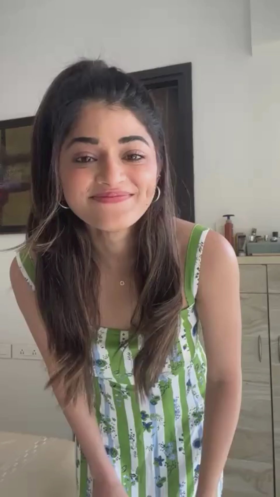 Actress Tasneem khan in Verdant Bloom – Striped Flared Midi Dress 3 twirling around in our mermaid cut dress