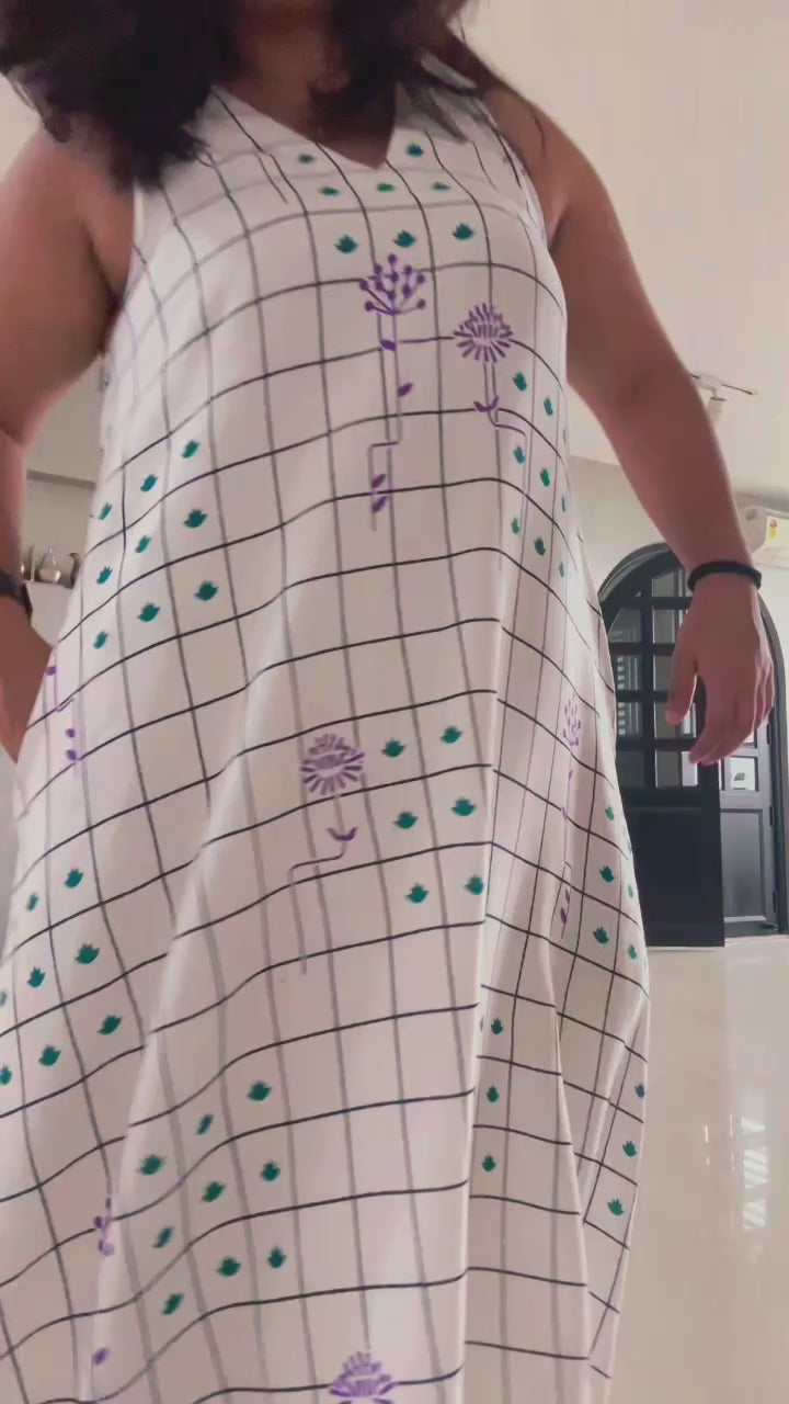 Grid Bloom – Rayon Summer Dress worn by Founder and twirling around. Rayon dress with light Cotton voile lining and big pockets in a dress