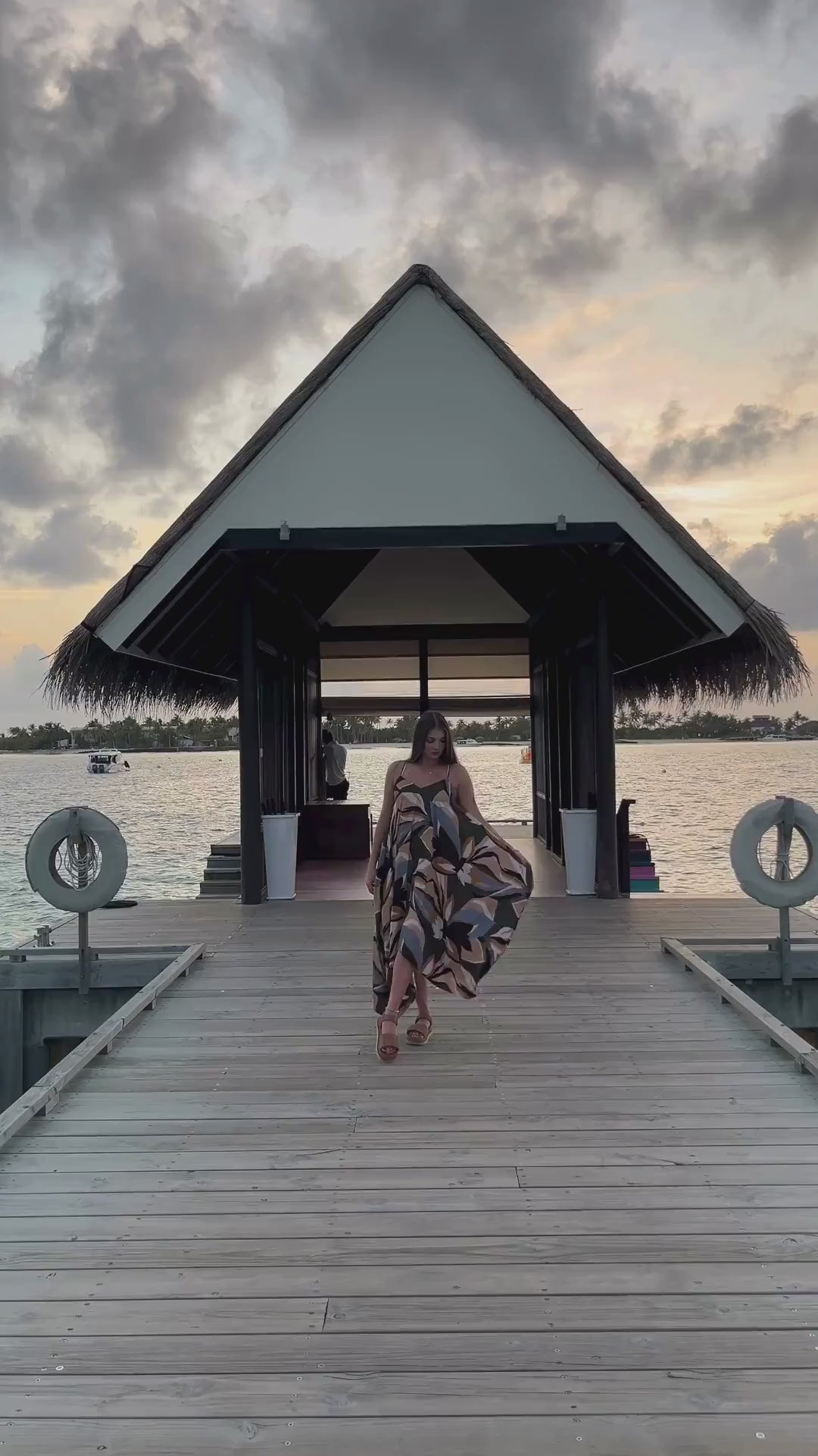 Client wearing tropical mirange dress in Maldives